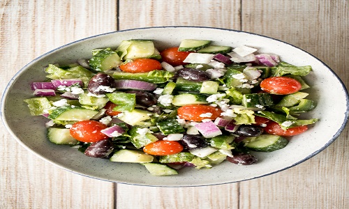 The perfect Greek salad with fresh tomatoes, cucumbers, red onions, green peppers, romaine lettuce, olives and feta cheese tossed in a lemon vinaigrette. | aheadofthyme.com